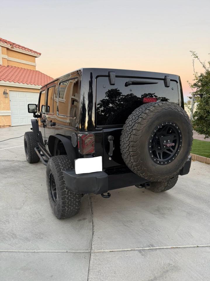 2014 Jeep Wrangler Unlimited Sahara - Фото 3